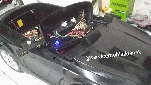 Service mobil mainan aki